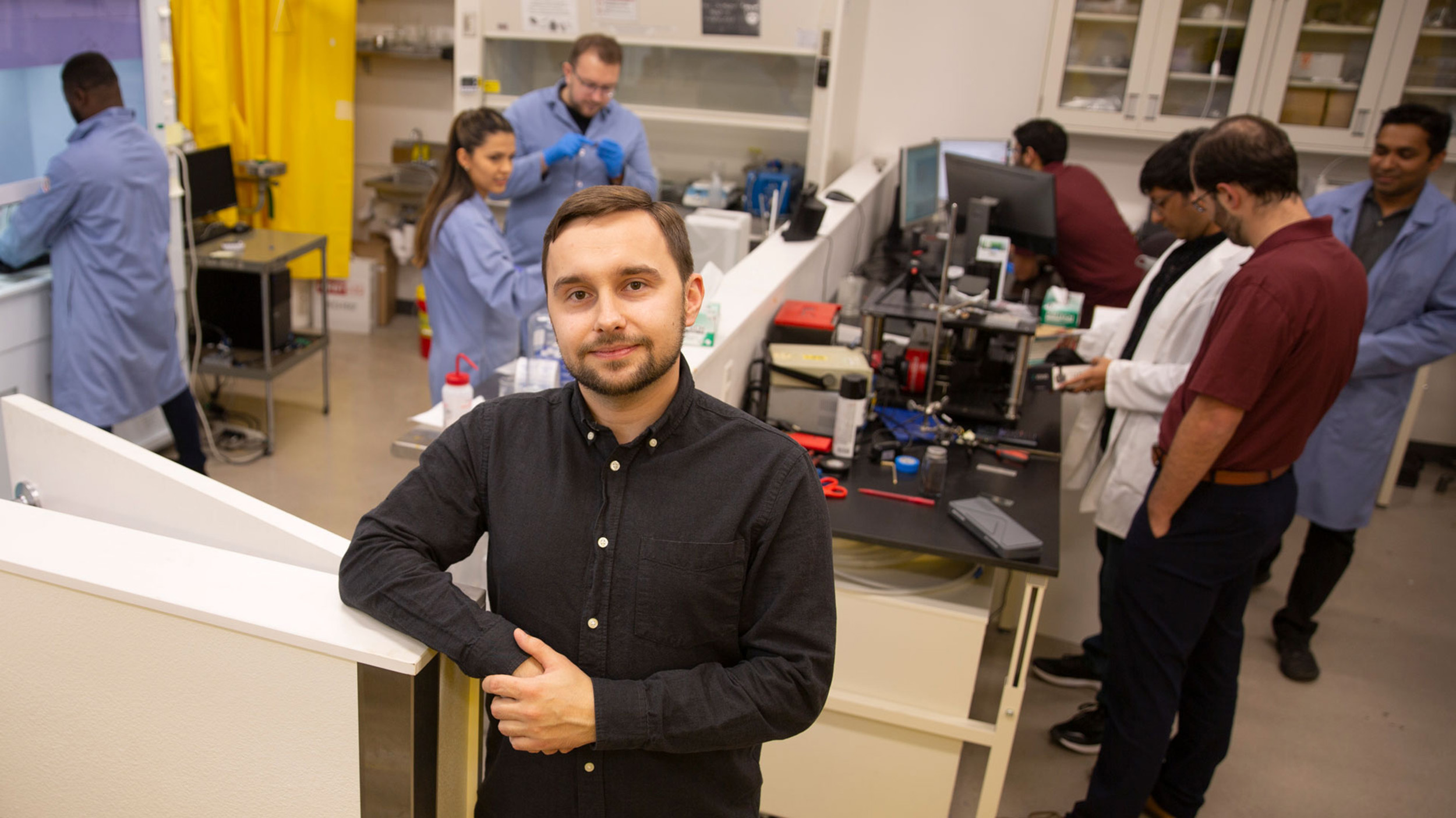 Aliaksandr Sharstniou poses in Bruno Azeredo's lab at ASU's Polytechnic campus