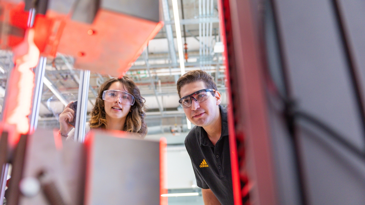 Students work on a robotics machine inside ISTB12, the newest facility on the Polytechnic campus, which will be dedicated to robotics and manufacturing. Photo by Armand Saavedra/ASU